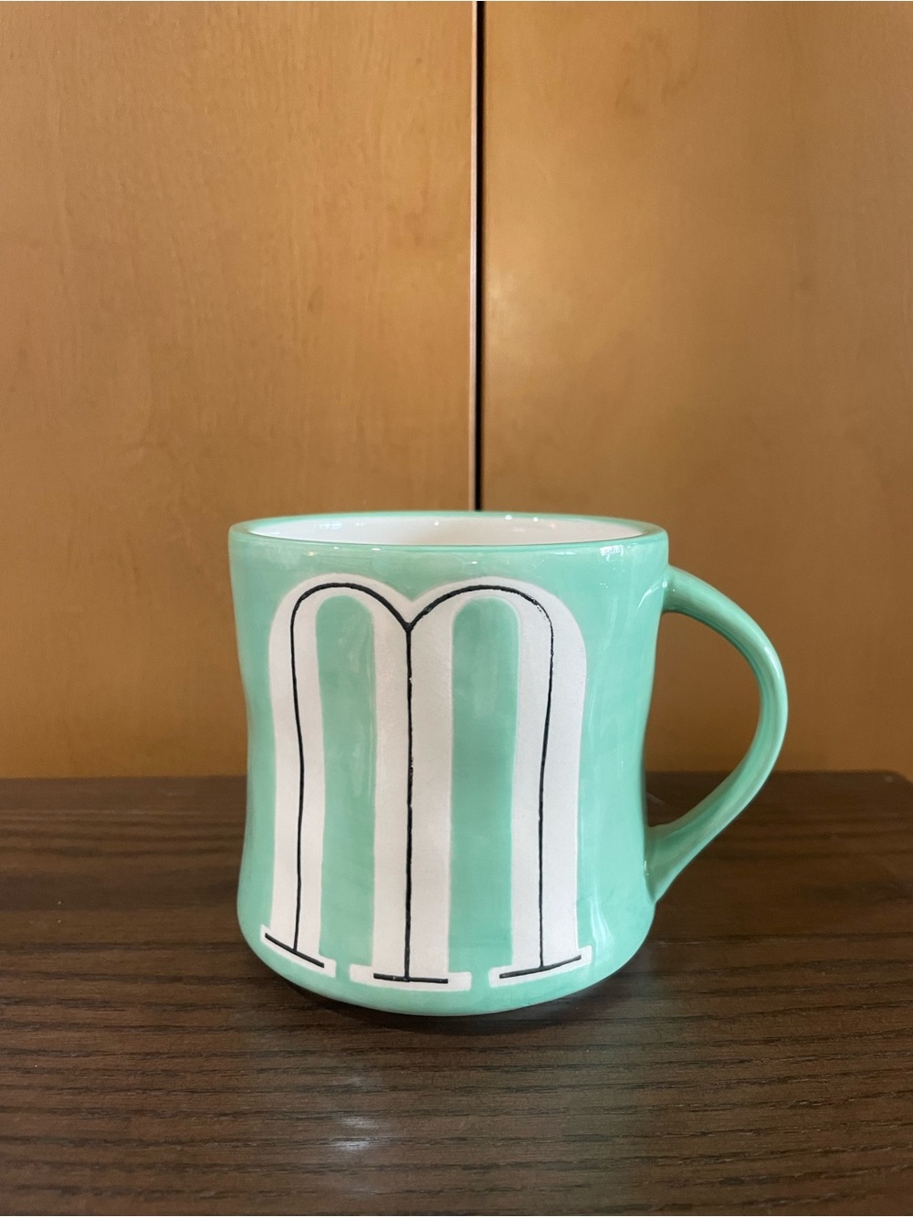 Anthropologie Mint Ceramic Mug with White 'M' Graphic